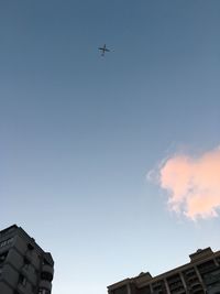 Low angle view of buildings against blue sky