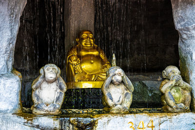 Buddha statue against building