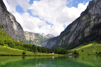 Scenic view of lake königssee by mountains against sky