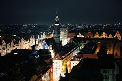 High angle view of illuminated buildings in city at night