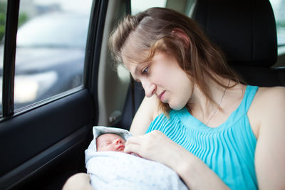 Woman sitting in car