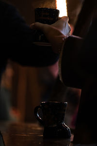 Close-up of man holding coffee