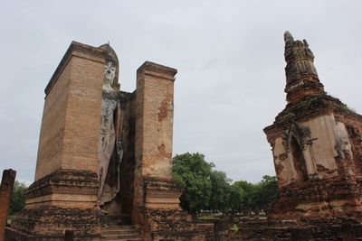 Low angle view of old temple building against sky