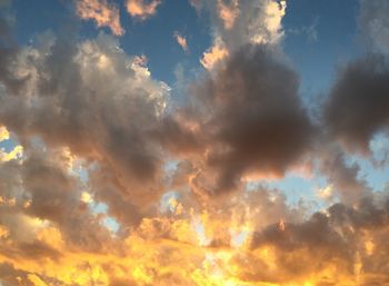 Low angle view of dramatic sky during sunset