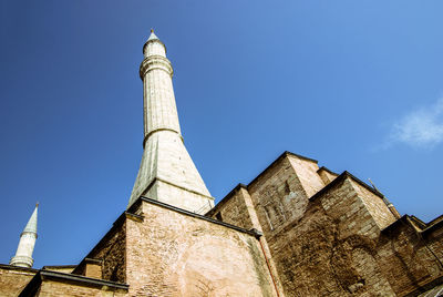 Low angle view of building against clear blue sky