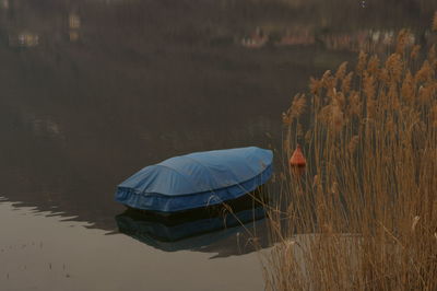 Reflection of boat in lake