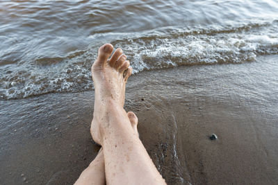 Low section of man on beach