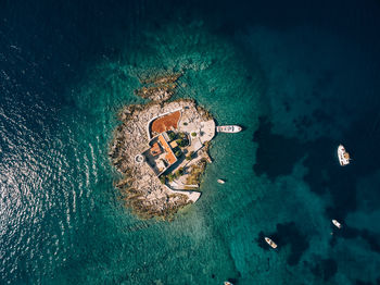 High angle view of rocks on sea shore