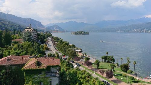 High angle view of buildings by sea against sky