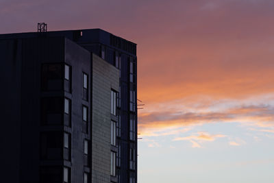 Low angle view of building against sky during sunset