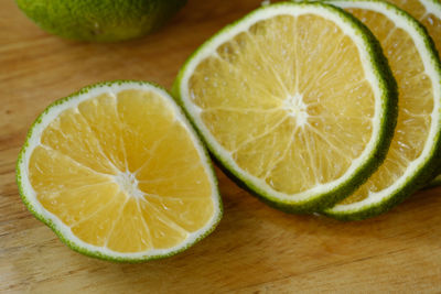 Close-up of lemon slice on cutting board