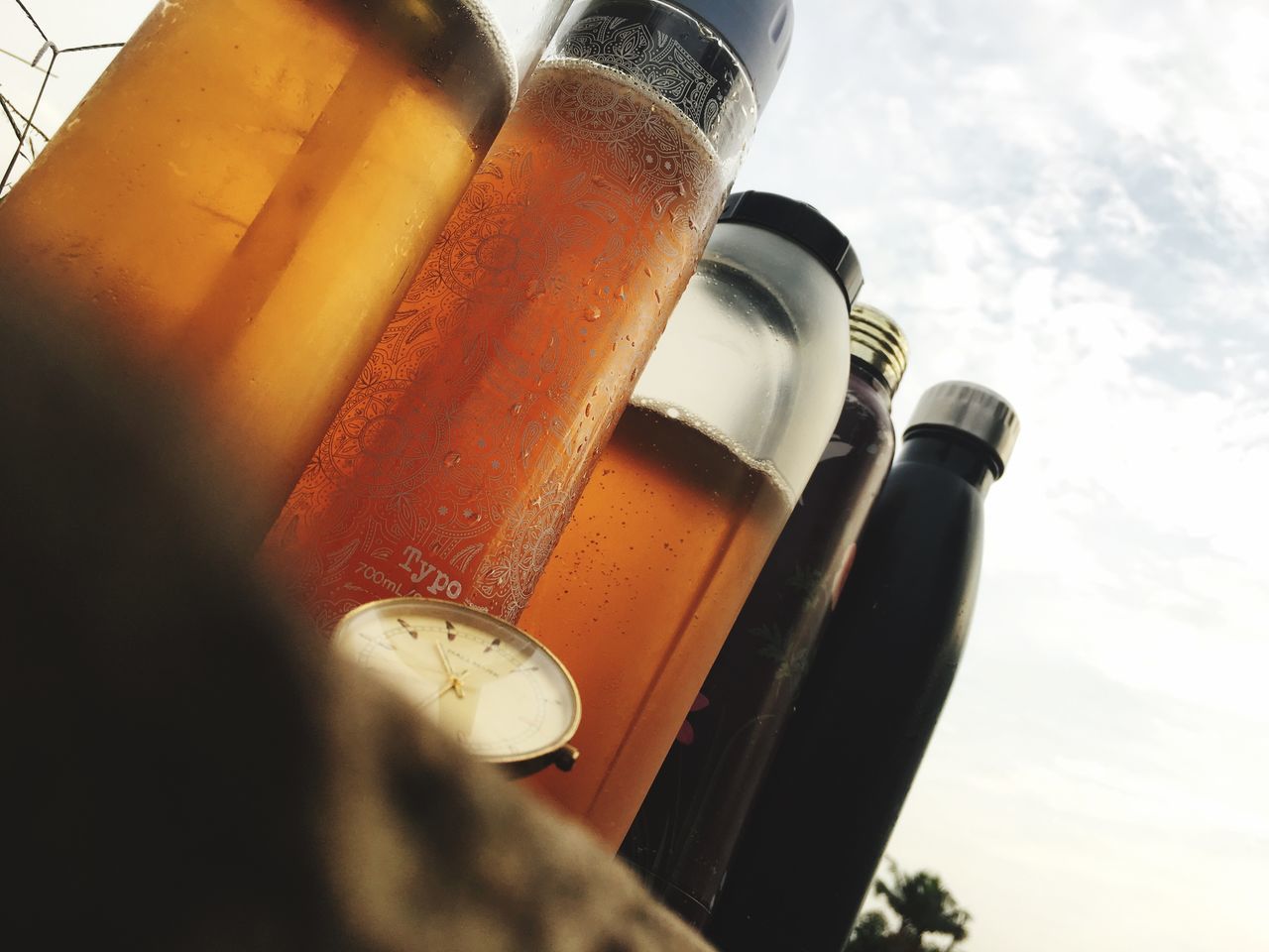 LOW ANGLE VIEW OF BEER GLASS BOTTLE