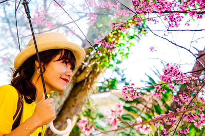 Portrait of young woman looking at camera
