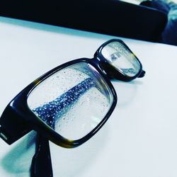 Close-up of eyeglasses on table