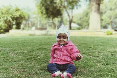 Happy girl smiling in grass