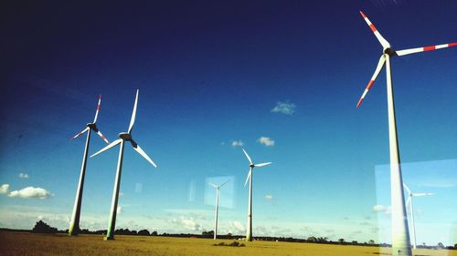 Wind turbines on field