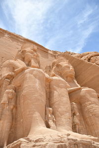 Low angle view of rock formation against sky