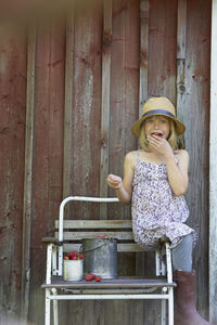 Girl eating strawberries