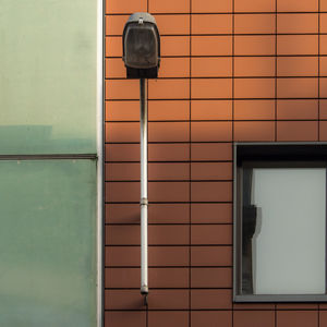 Low angle view of street light on building