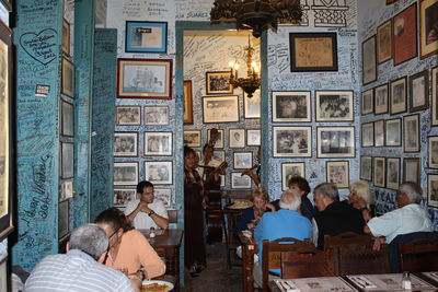 Group of people sitting in front of building
