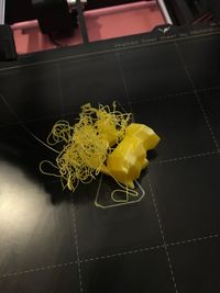 High angle view of yellow flower on floor