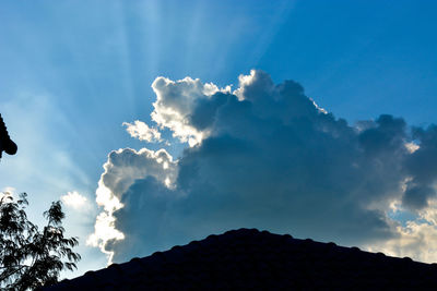 Low angle view of silhouette mountain against sky