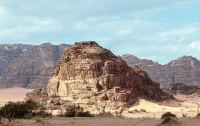 Rock formations on landscape against sky