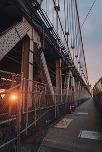 Bridge in city against sky