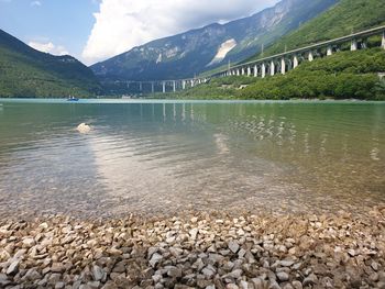 Scenic view of lake and mountains against sky