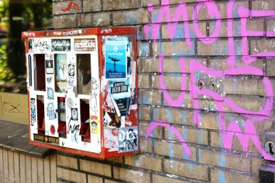 Close-up of graffiti on brick wall