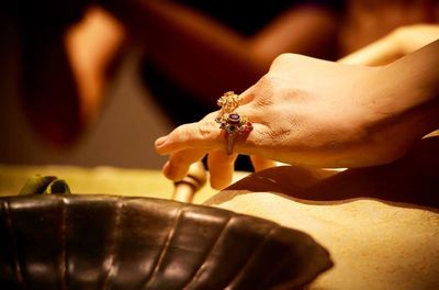 Close-up of rings on wax figurine at museum