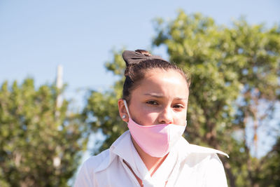 Portrait of girl wearing medical face mask