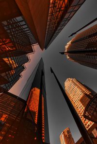 Low angle view of modern buildings in city against sky