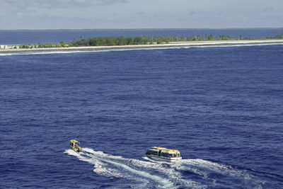 High angle view of boat in sea against sky