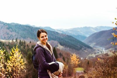 Portrait of young woman in mountains