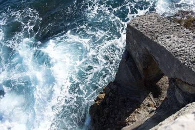 High angle view of rocks in sea