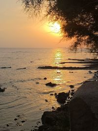 Scenic view of sea against sky during sunset