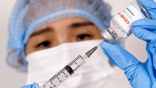 Close-up of human hand holding umbrella