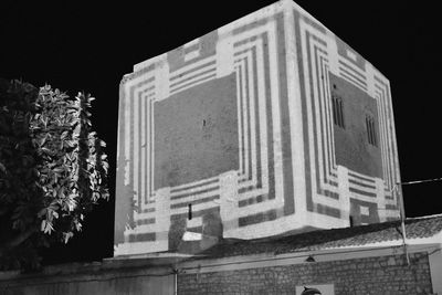 Low angle view of building against sky at night