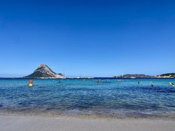 Scenic view of sea against clear blue sky