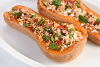 Baked stuffed pumpkin filled with walnuts, fresh mint and chili with quinoa tabbouleh.  