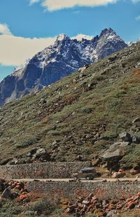 Scenic view of landscape and mountains against sky