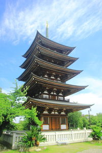 Low angle view of pagoda against sky