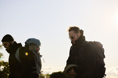 View of backpackers walking together