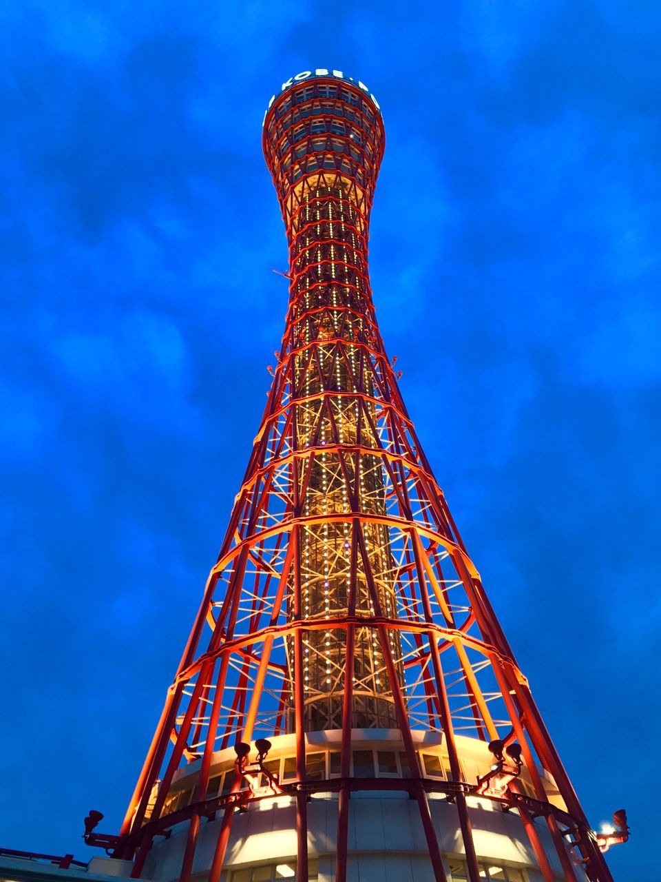 low angle view, architecture, built structure, sky, blue, day, outdoors, no people, amusement park, amusement park ride