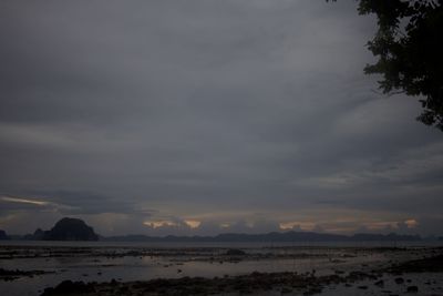 Scenic view of beach against sky during sunset