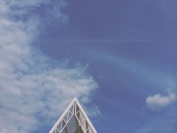 Low angle view of built structure against cloudy sky