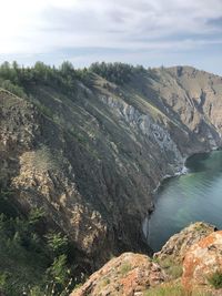 High angle view of rocks on shore against sky