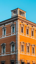 Low angle view of building against clear blue sky