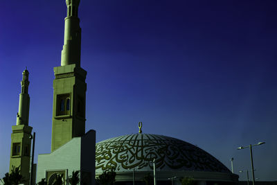 Low angle view of building against blue sky